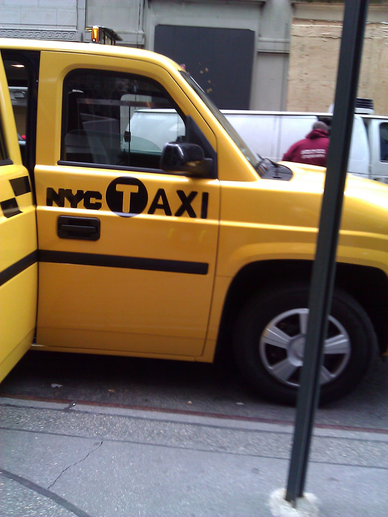 larger photo of a yellow Nissan MV-1