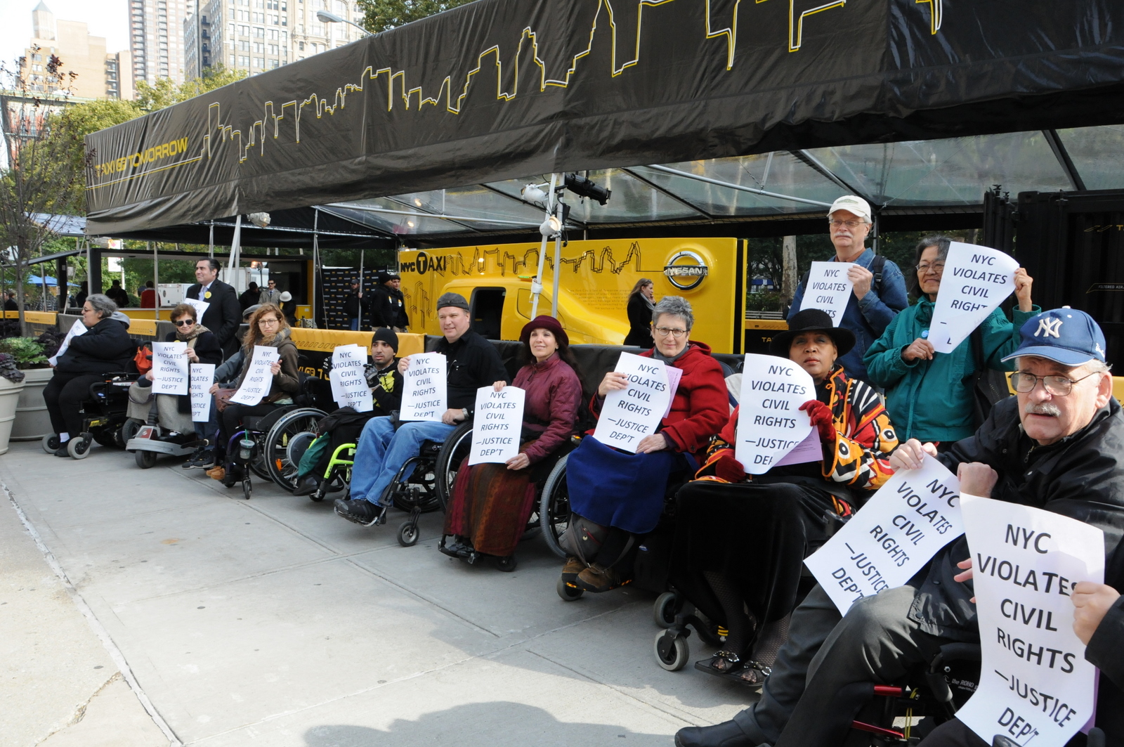 photo of demonstrators protesting the Taxi of Tomorrow