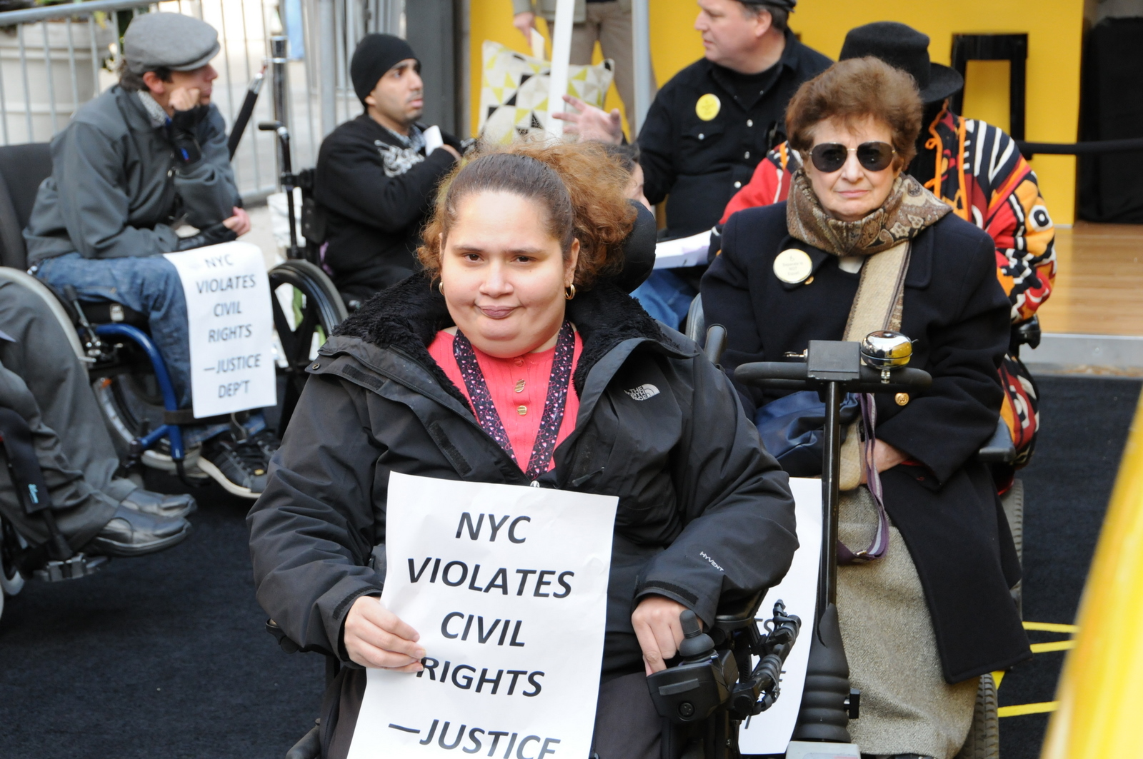 photo of demonstrators in wheelchairs in a line