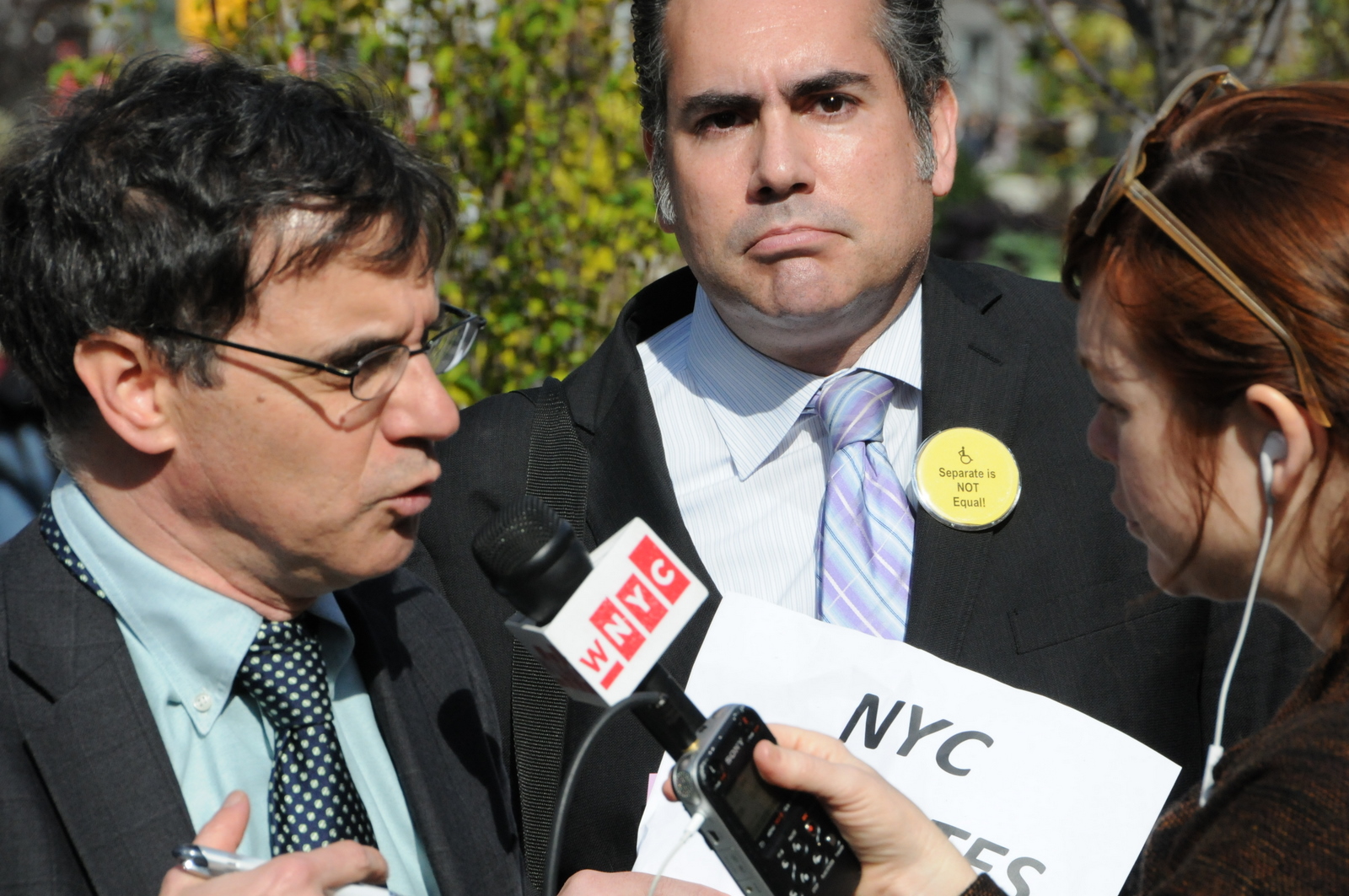 photo of Joseph Rappaport and Jamin Sewell with a reporter